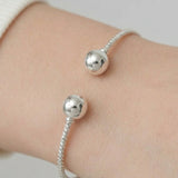 Sterling Silver Modern Twist Ball Bangle Bracelet